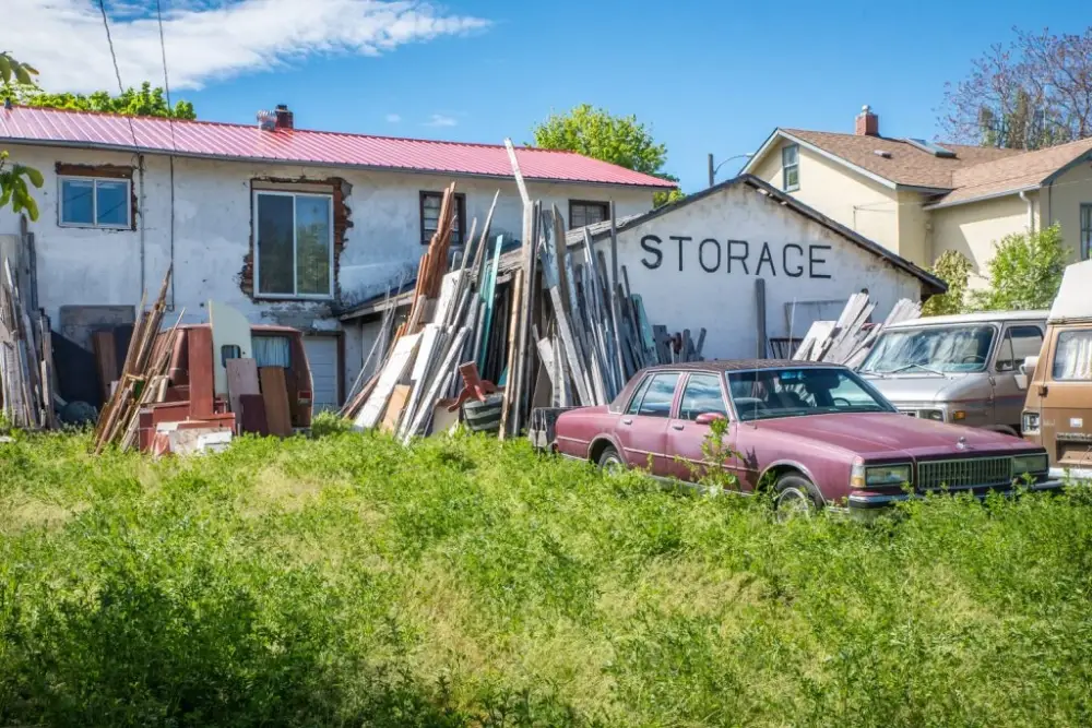 a house with a bunch of cars parked in front of it.