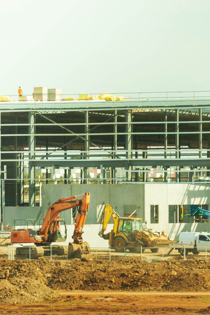 a large cement structure with a crane on top of it.